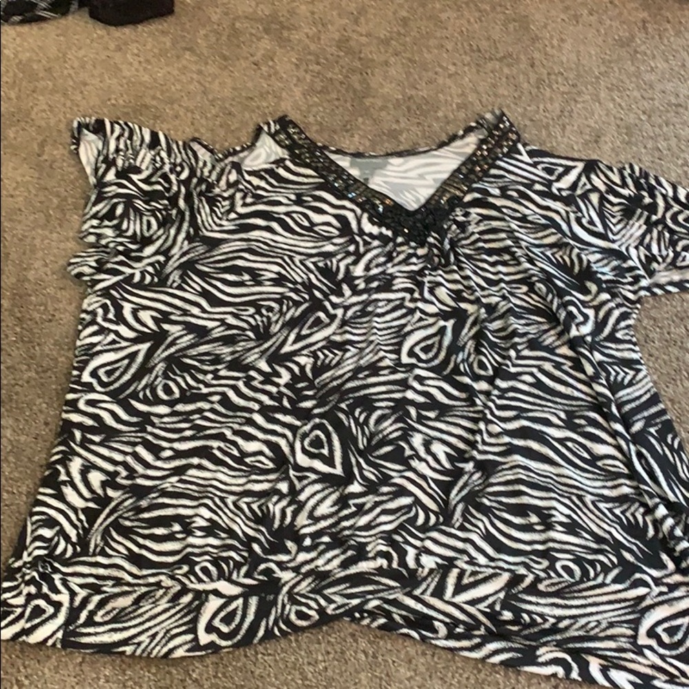 We have this black and white blouse